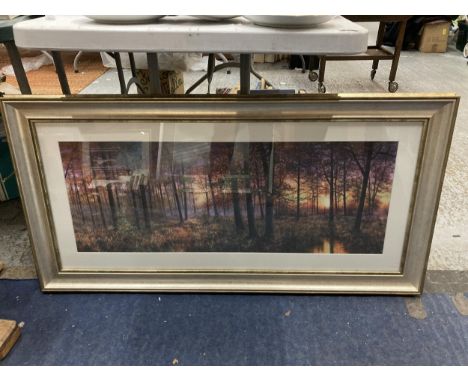 A LARGE PRINT OF A WOODLAND SETTING 112CM X 57CM 