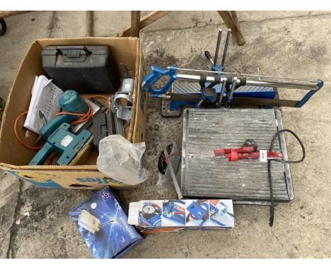 AN ASSORTMENT OF TOOLS TO INCLUDE A TILE CUTTER, ELECTRIC SANDERS AND A MITRE SAW ETC 
