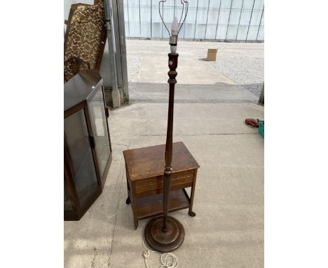 AN OAK SEWING WORK BOX ON WHEELS AND STANDARD LAMP 