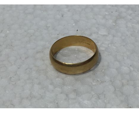 A HALLMARKED 18CT GOLD RING MARKED 750 WEIGHT 7.7 GRAMS 