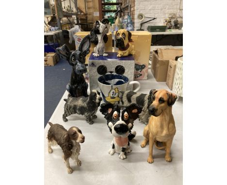 A QUANTITY OF RESIN AND CERAMIC DOGS TO INCLUDE 'LITTLE PAWS' CARTOON STYLE, SPANIELS PLUS A BOXED DISNEY PLUTO MUG 