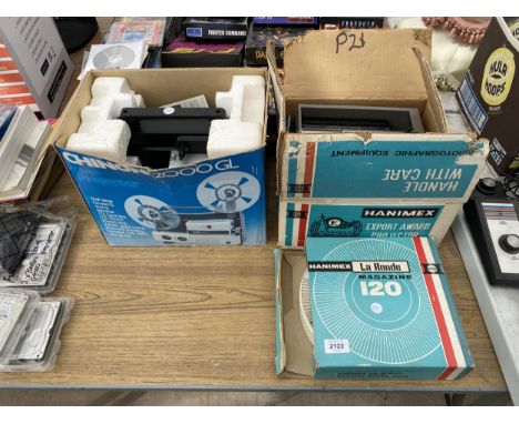 A CINE PROJECTOR, A HANIMEX SLIDE PROJECTOR AND AN ASSORTMENT OF SLIDES 