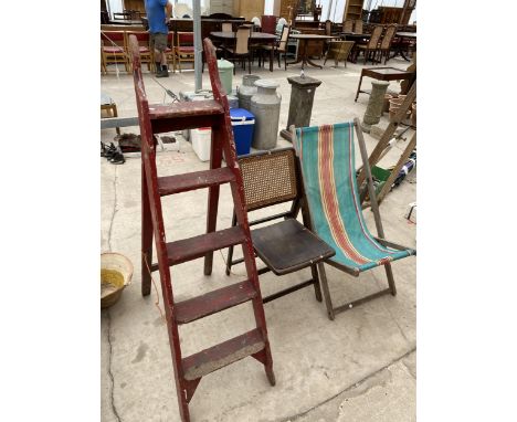 A FOLDING DECK CHAIR, A FURTHER FOLDING CHAIR AND A FOUR RUNG WOODEN STEP LADDER 