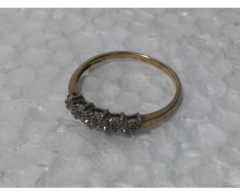A 9CT GOLD RING WITH DIAMONDS 