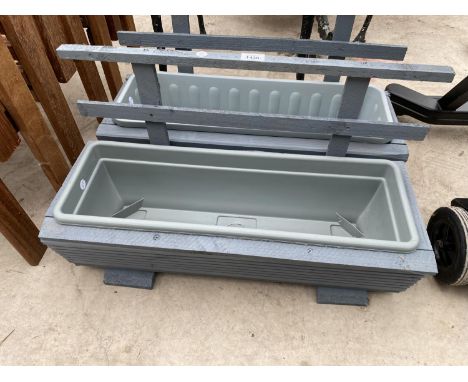 A PAIR OF WOODEN TROUGH PLANTERS WITH PLASTIC INSERTS 