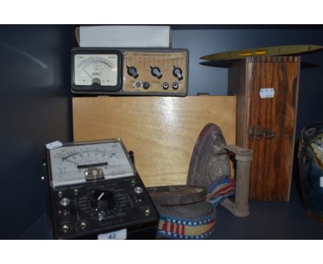 A selection of vintage volt meters and similar,a flat iron and trivet.