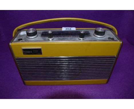 A vintage mid century mustard yellow radio by Roberts