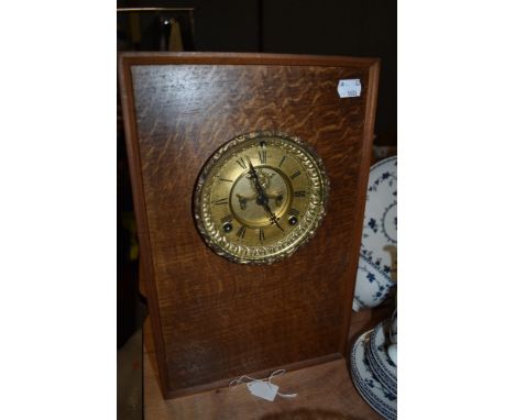 A clock mounted into a vintage speaker casing.