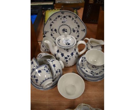 A partial Royal Doulton'Yorktown' tea service including tea pot, cups and saucers and more.