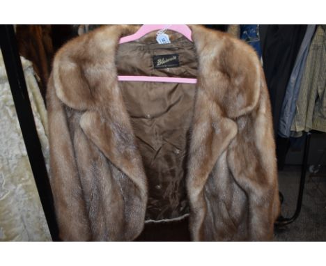 A vintage blonde mink short jacket,soft and supple and in a smaller size.