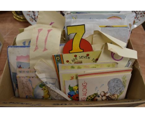 A box full of vintage greetings cards.
