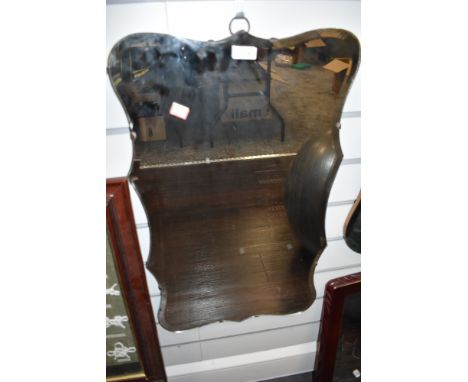 A vintage bevelled edge wall mirror with scalloped edge.
Condition Report - size 67cm x 40cm approx