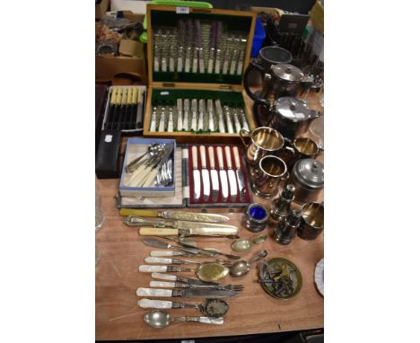 A collection of vintage canteens and flat ware including mother of pearl handled,caddy spoons and more.