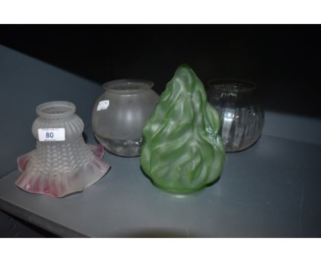 Four vintage glass lamp shades including unusually shaped green shade and fluted shade with pink tint to edge.