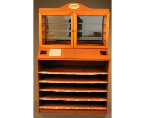 A large 1990's Corgi Classics 'Collector's Club' light up shop display with enclosed glass shelves and open storage space to 