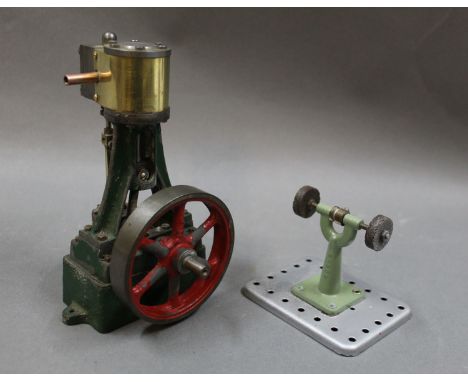 A Stuart vertical stationary engine, in red and green, and a Mamod grinding machine  