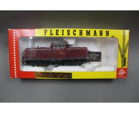 A Fleischmann HO scale bo-bo diesel schunter, in maroon, displayed within a 3265 box  