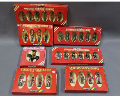 A box lot of 1980's Britain's hand painted metal soldiers: Scots Guard, Piper and 5 men (7238), Royal Canadian mounted police