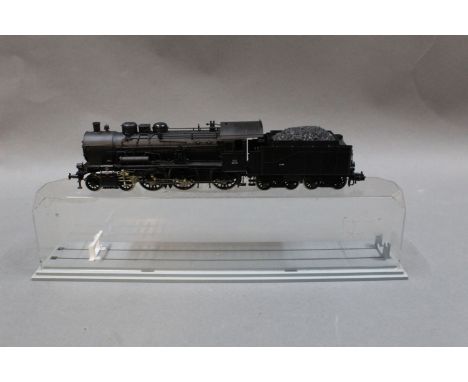 A Fleischmann HO scale 4-6-0 SNCF tank locomotive and tender in a plastic Jouef display box