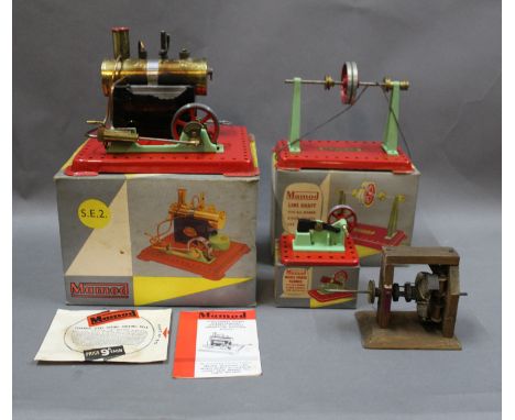 A group of 3 1970's Mamod models, consisting of a line shaft, with mazak fly wheel, a model power hammer, and an SE2 stationa