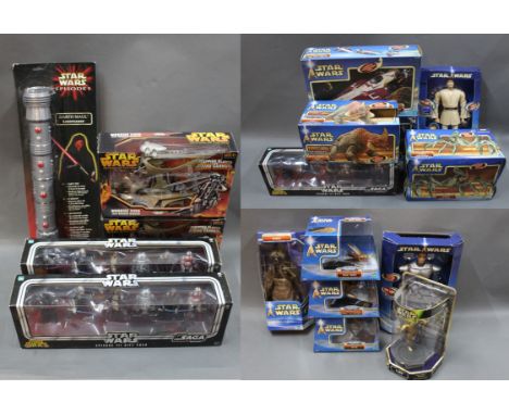 2 boxes of Hasbro and other Star Wars models, to include a Darth Maul Episode One light saber, 2 Episode 3 gift packs, and "A
