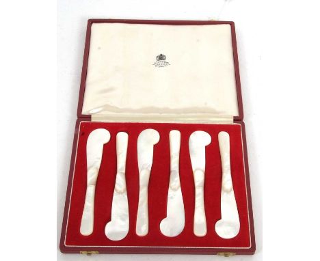 An Asprey &amp; Co cased set of six mother of pearl caviar spreaders, the silk linked lid with "By Appointment to the Queen, 