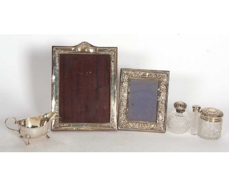 Mixed Lot:  An Edwardian silver mounted photograph frame, the arched top and corners decorated with garlands of flowers, hall