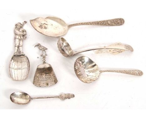 Mixed Lot:  An antique Dutch silver spoon, cast figural handle depicting a man playing the pipes and standing on a barrel, 11