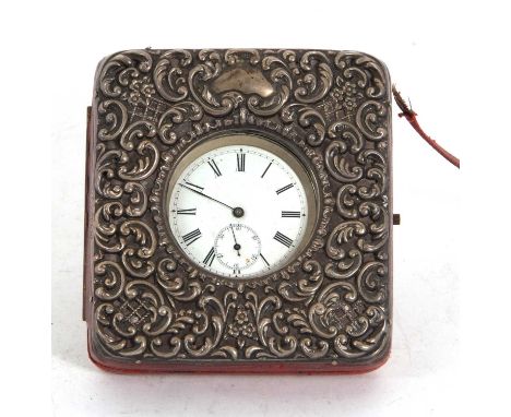 An Edwardian silver mounted and leather pocket watch case/stand, the front embossed with scrolls, grills, flowers etc, easel 