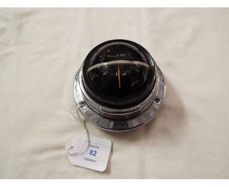A nautical Aqua Meter compass with chrome bezel