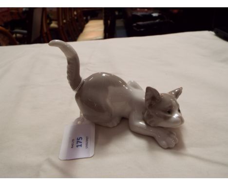 A Lladro figure of a prowling cat