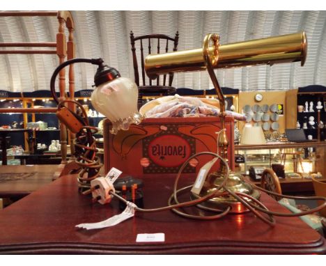 A brass banker's lamp together with a black painted table lamp with crimped glass shade