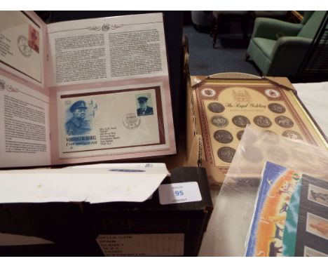 A selection of coins, first day covers and books to include Churchill Centenary first day covers 1874 - 1974, Kings & Queens 