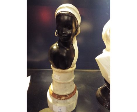 A ceramic figure of a blackamoor female raised on a marble base