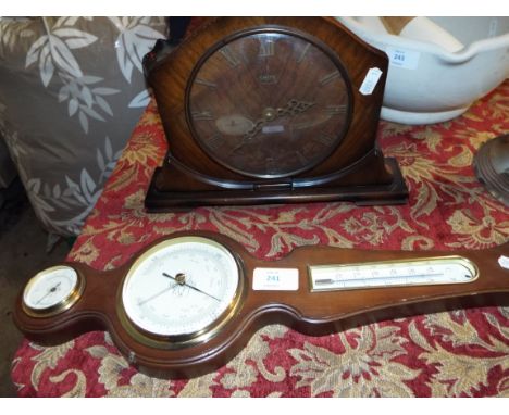 A 1940s Smith's walnut cased mantel clock together with an aneroid barometer    