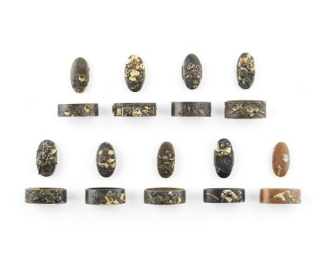 Nine fuchi-gashira (hilt collars and pommels)Edo period (1615-1868), 18th to 19th centurySeven of shibuichi, one of shakudo, 