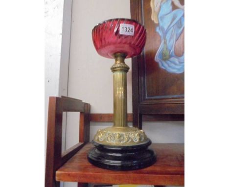 A brass oil lamp base with cranberry glass font (font a/f, crack to underside).