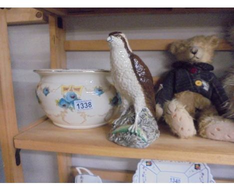 A vintage chamber pot and a Beneagles Osprey decanter.