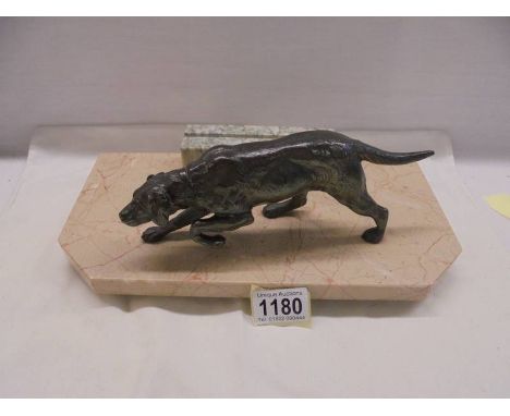A bronze? hunting dog on a marble base as a photo frame.Base 31 x 15cmDog Length 22cmTotal Height 12cm 