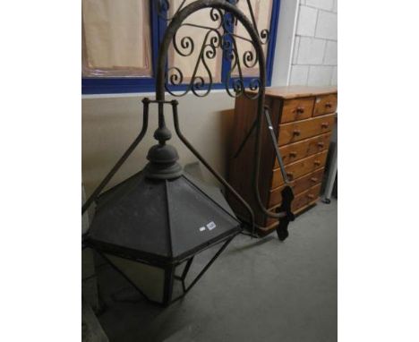 A Hexagonal 'gas lamp' with original ornate bracket and 6 replacement perspex panels. Overall height 166 cm, protrudes 138 cm
