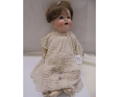 A 19th century Armand Marseille Germany 990 A-4-M porcelain doll.