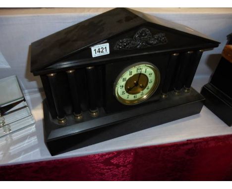 A heavy black slate paladian style mantel clock, COLLECT ONLY.