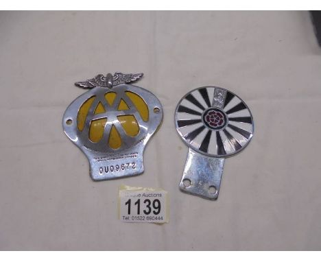 An enamel Rotary Club car badge and an AA car badge.