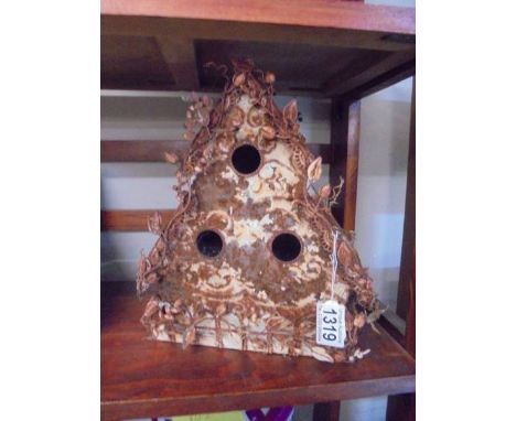 An unusual vintage tin bird house.