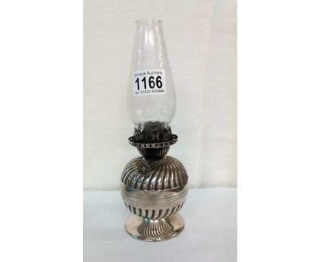 A Victorian Hinks silver plated bedroom oil lamp.