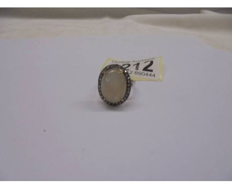 Oval cabochon moonstone and rose-cut diamond ring. Moonstone 7.95ct. Diamonds 0.37ct, size M. 6.2 grams.
