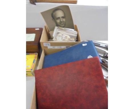 A good lot of old postcards, photographs and first day covers in two boxes and two albums.