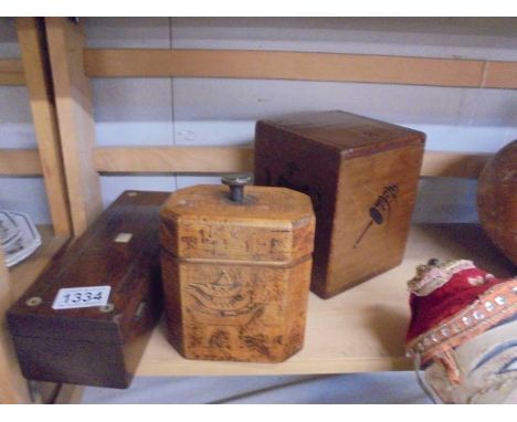 A vintage tea caddy and two other boxes.