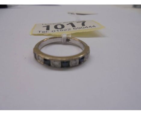 An 18ct gold sapphire and diamond ring, size M, 3.4 grams.