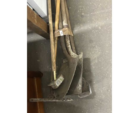 Assortment of various garden tools to include shovels, rakes, hoes etc